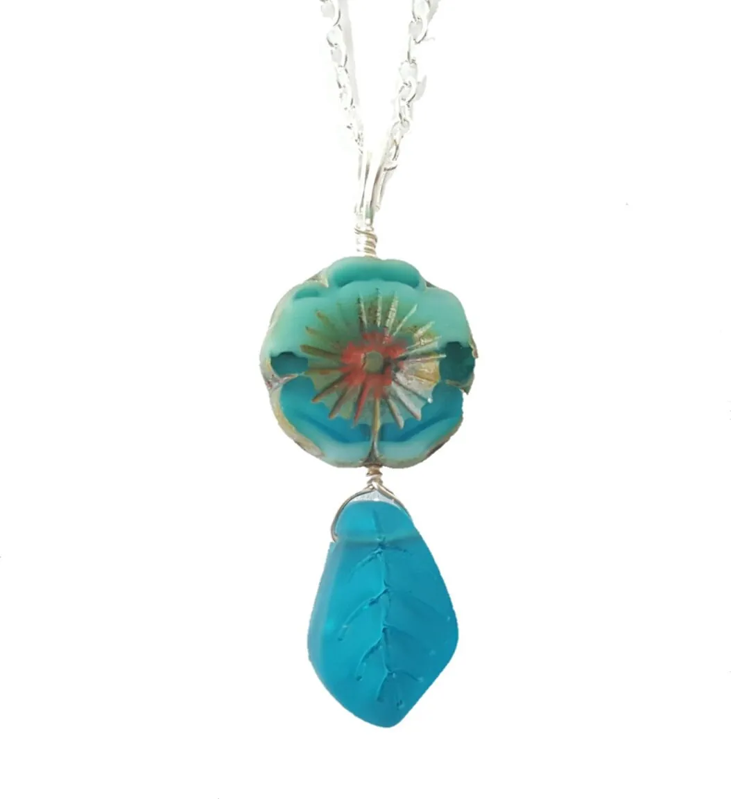 Handmade in Hawaii, Bohemian glass Hawaiian Flower bead with sea glass carved leaf, a beautiful necklace with matching earrings in my store