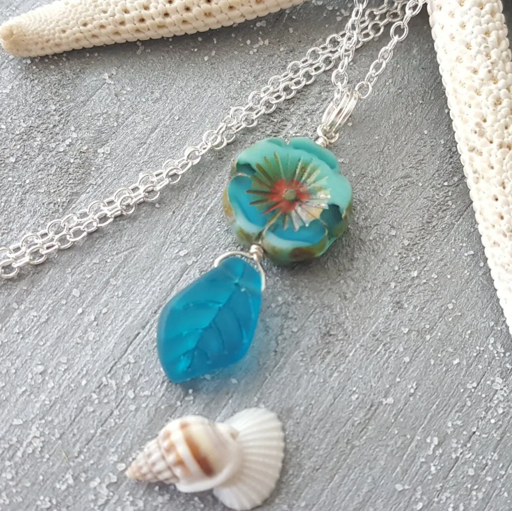 Handmade in Hawaii, Bohemian glass Hawaiian Flower bead with sea glass carved leaf, a beautiful necklace with matching earrings in my store