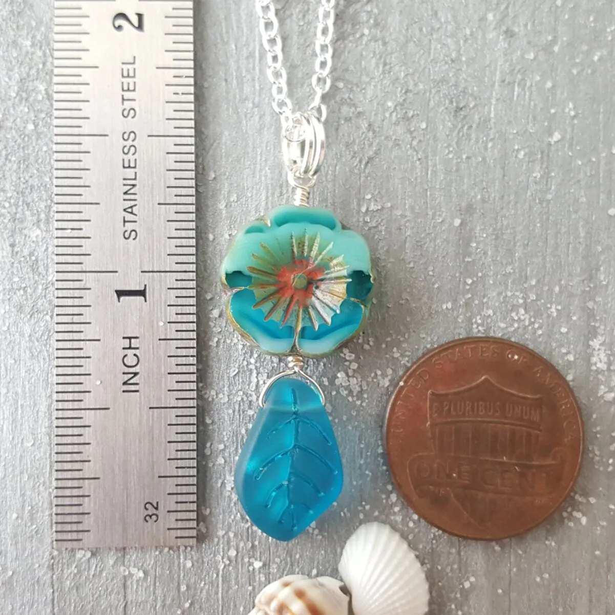 Handmade in Hawaii, Bohemian glass Hawaiian Flower bead with sea glass carved leaf, a beautiful necklace with matching earrings in my store
